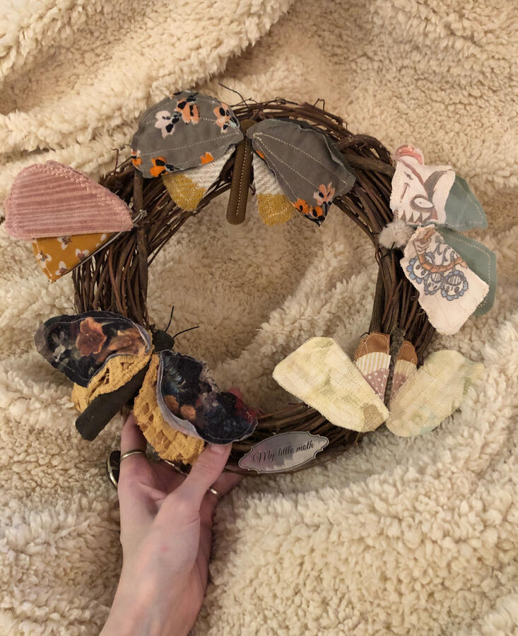 Fabric and wire moth wreath