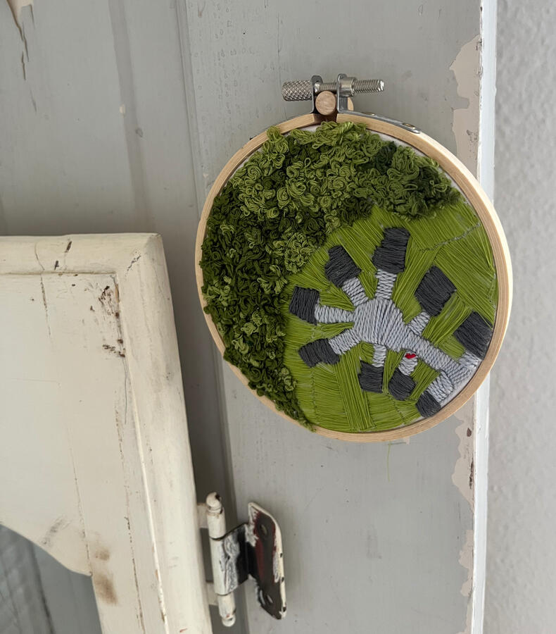 Embroidered overhead view of cul de sac from Our Tragedy